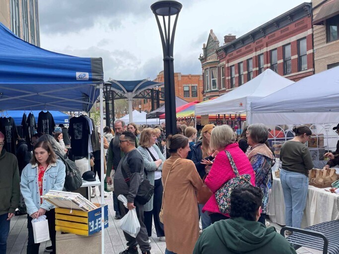 People browsing items at an outdoor market